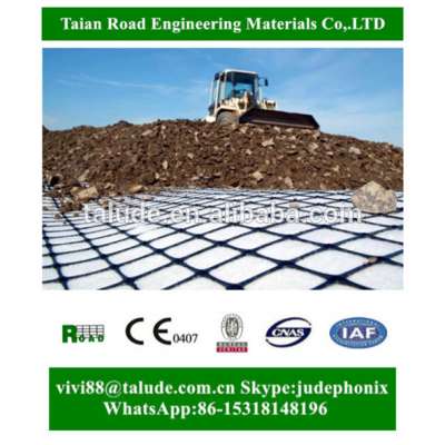 Composite geogrid for basal reinforcement of embankments